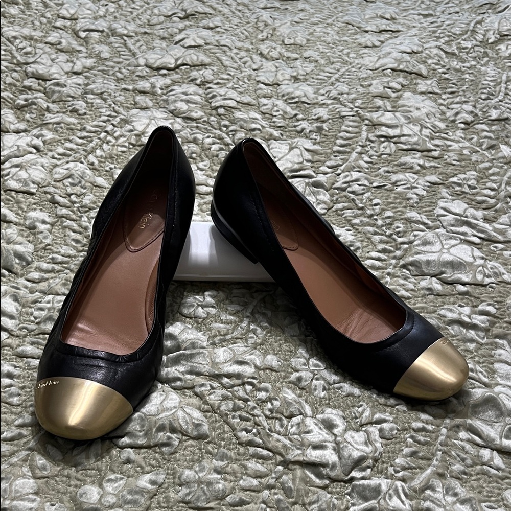 Calvin Klein Black and Gold Cap Toe Flats